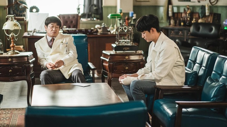 Oh Ji-wang and Moon Gang-tae sitting in a lavish office in It's Okay to Not Be Okay (2020)