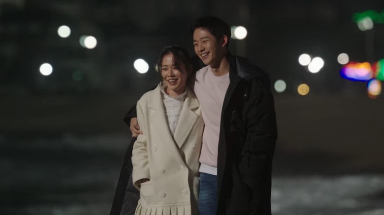 Yoon Jin-ah and Seo Jun-hui walking outside together in Something in the Rain 2018)
