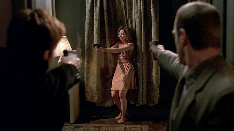 Benson and Stabler pointing guns at Maggie Peterson on Special Victims Unit