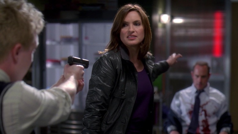 Stuckey pointing a gun at Benson and Stabler in Special Victims Unit