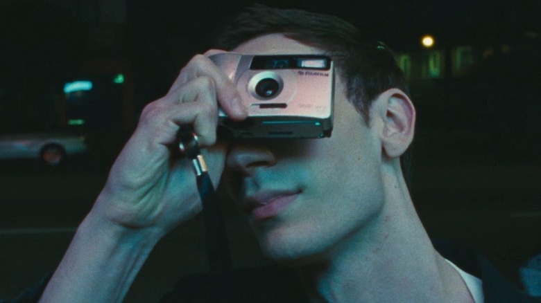 Matthew taking a photo at night in Lurker
