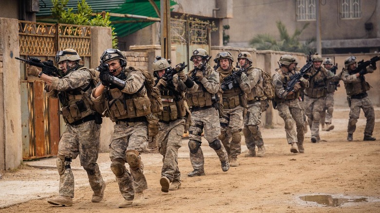 A group of soldiers patrol the area in Warfare