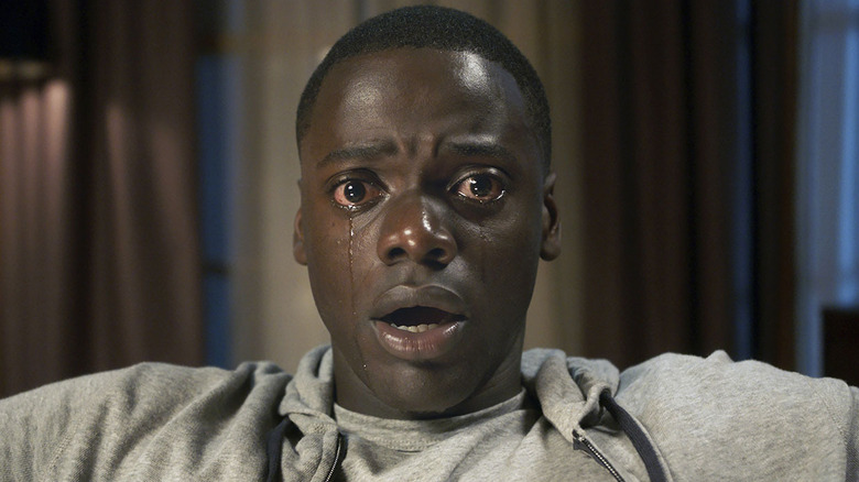 Chris cries with bloodshot eyes in "Get Out" (2017)