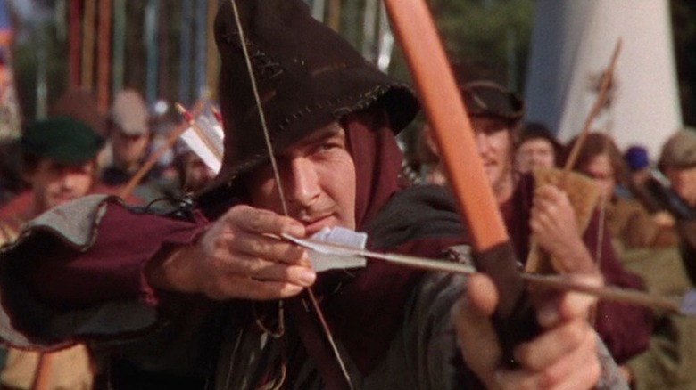 Robin Hood prepares to shoot an arrow in The Adventures of Robin Hood (1938)
