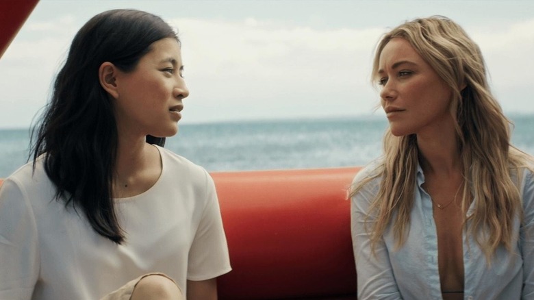 Michelle and Kaz sat talking together on a boat in "Great White"