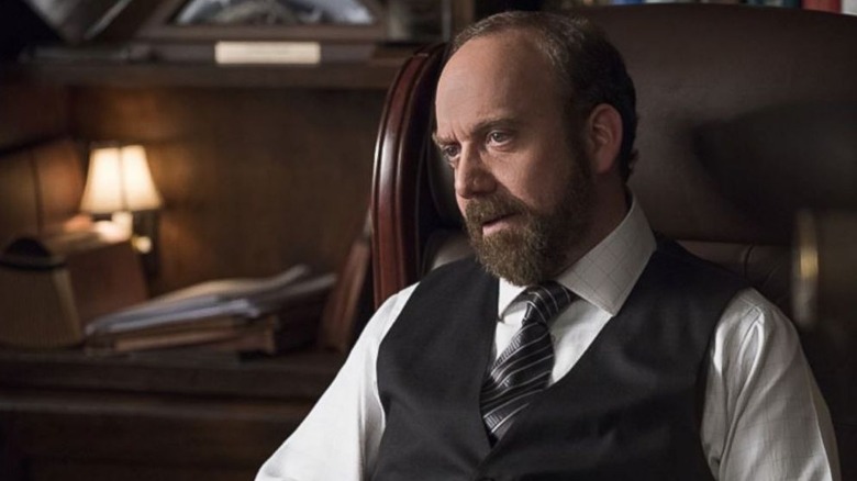 Rhoades sits in a big leather chair in Billions