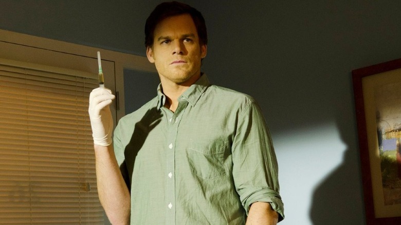 Dexter holds up a syringe in Dexter