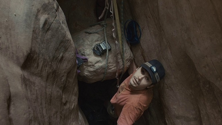 Aron in the cliff in "127 Hours" (2010)