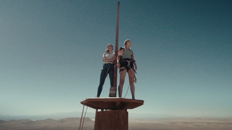Becky and Shiloh stranded on top of a tower in "Fall" (2022)