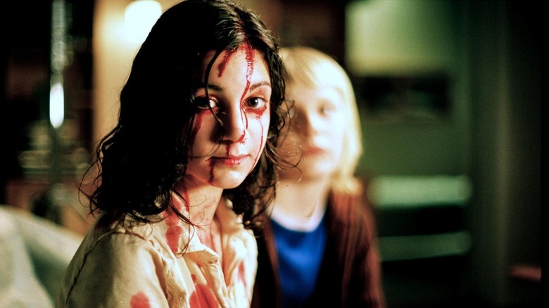 Oskar and a bloody Eli in "Let the Right One In"
