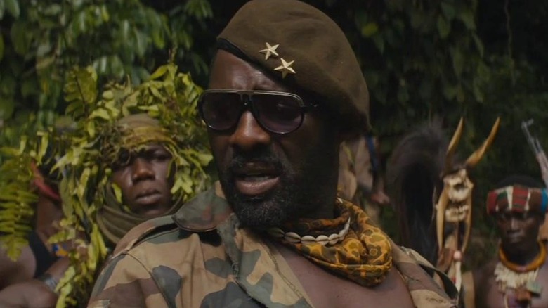 Commandant looks over his shoulder in Beasts of No Nation (2015)