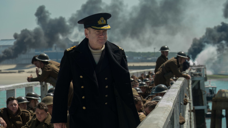 Commander Bolton surveys the destruction from the pier in Dunkirk (2017)