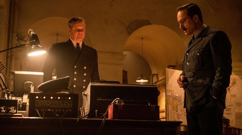 Ewen and Charles examine a code machine in Operation Mincemeat (2021)