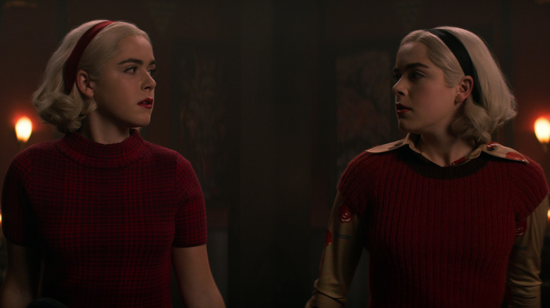 The Sabrinas (Spellman and Morningstar) looking at each other