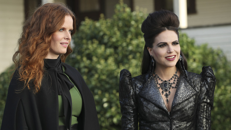 Zelena (or the Wicked Witch of the West) and Regina (or the Evil Queen) smiling