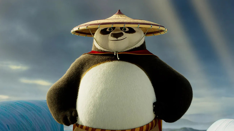 Po smiling with hands on hips (2024)
