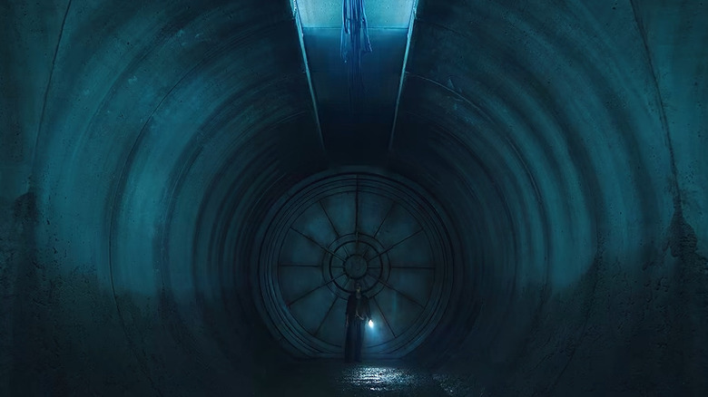 Juliette Nichols standing in a dark tunnel with a pistol and a flashlight in Silo season 4 (2027)
