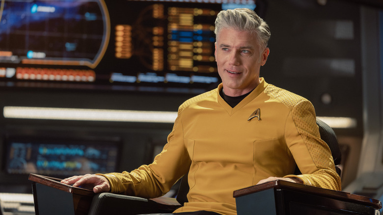 Captain Christopher Pike smiling on the bridge of the Enterprise in Star Trek: Strange New Worlds (2022)
