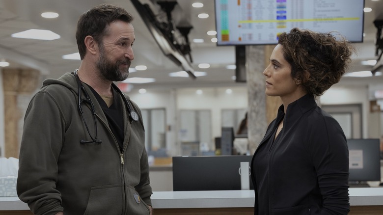 Dr. Michael Robinavitch and Dr. Baran Al-Hashimi talking to each other in the middle of the ER in The Pitt season 3 (2027)