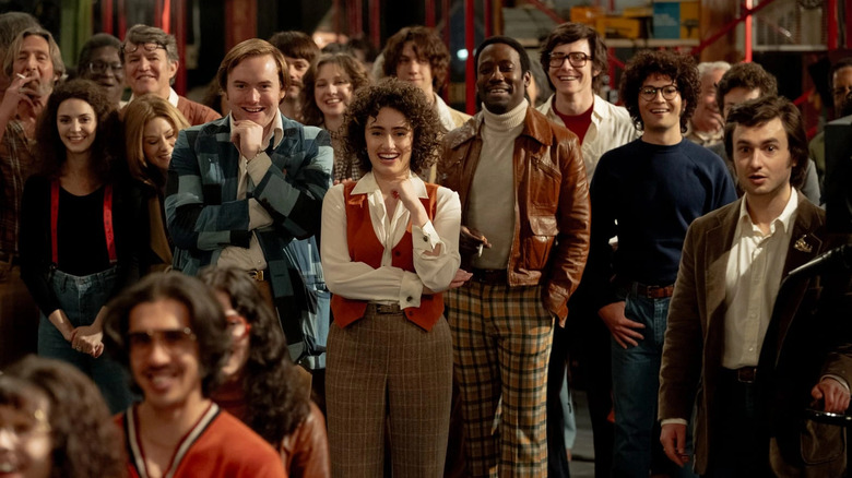 Gilda Radner, Jane Curtin, Lorne Michaels, and others share a laugh in "Saturday Night"