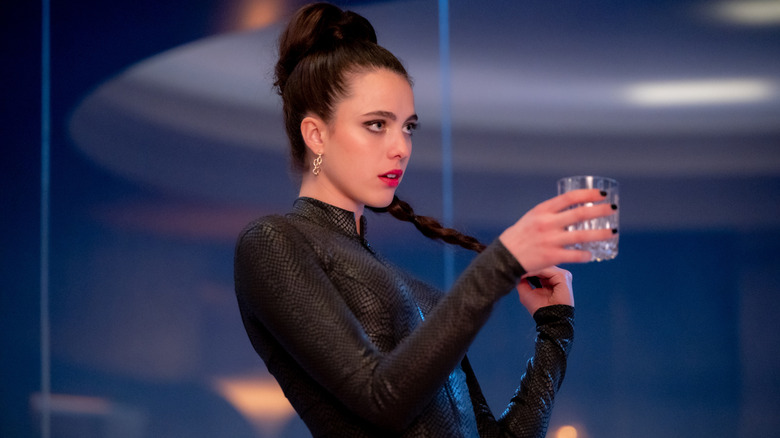 Sue raises a glass in "The Substance"