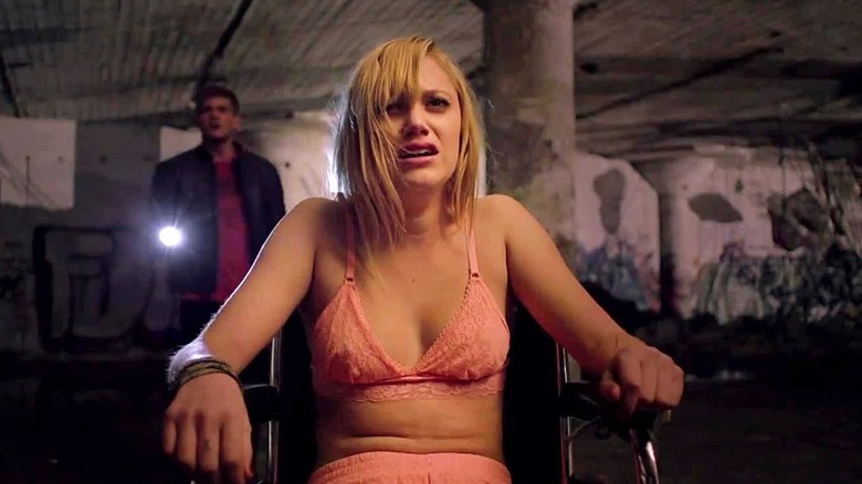 Jay is tied to a chair in "It Follows" (2014)