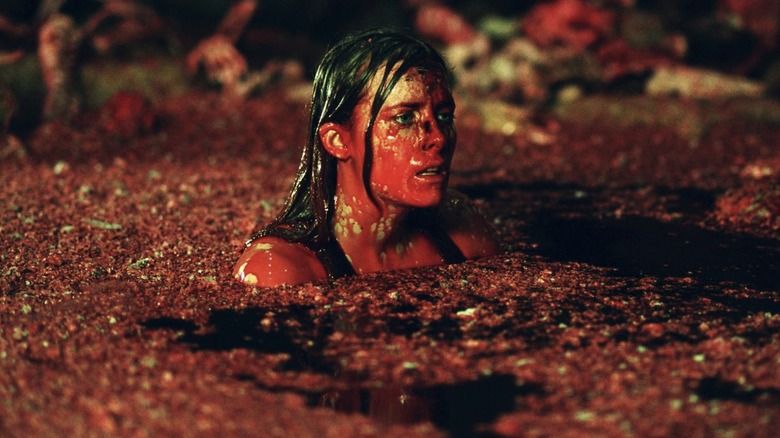 Sarah wades through foul water in "The Descent" (2005)