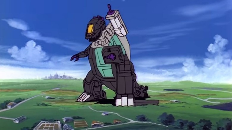Trypticon looming over a field on The Transformers
