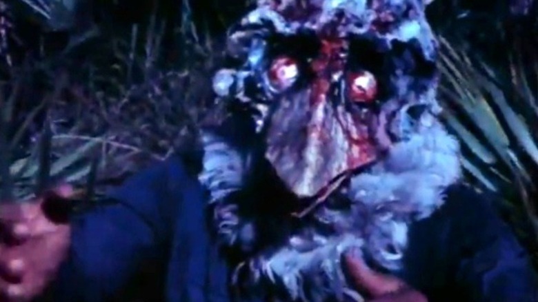 A half-man, half-turkey monster rampages in "Blood Freak" (1972)