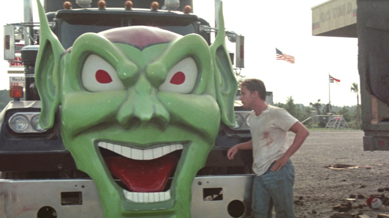 Bill Robinson looks at the Green Goblin truck in "Maximum Overdrive" (1986)