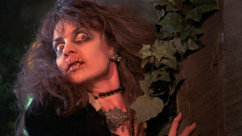 An Evil Goblin woman emerges from behind a tree in "Troll 2" (1990)