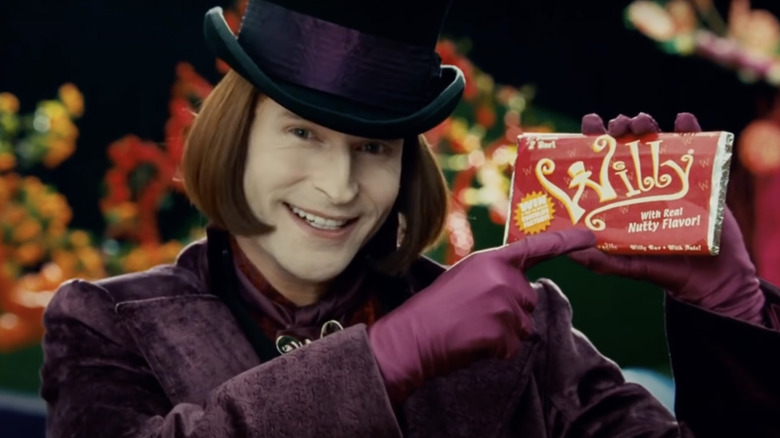 Wonka holding candy bar