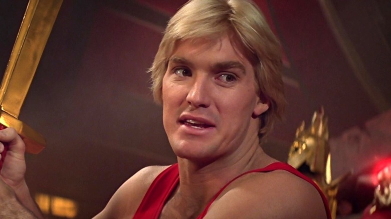 Flash Gordon looking at Ming's ring in Flash Gordon