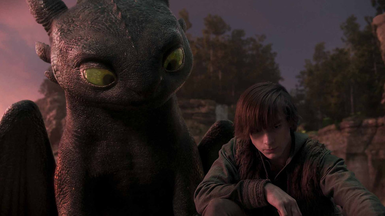 Toothless and Hiccup looking at something on the ground (2025)