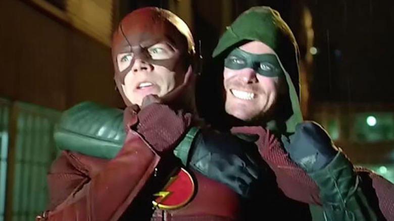 Arrow puts Flash in a headlock