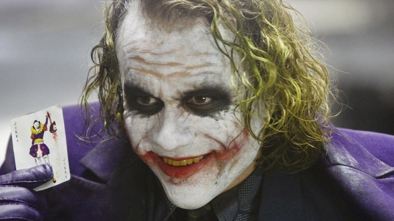 Heath Ledger Joker holding card