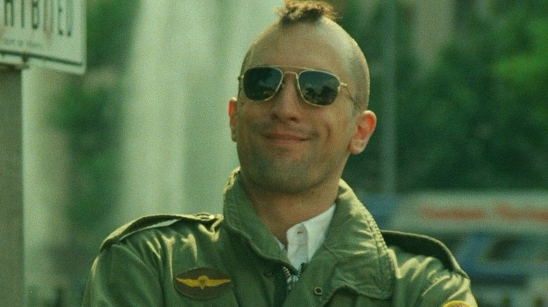 Travis Bickle smiling in 