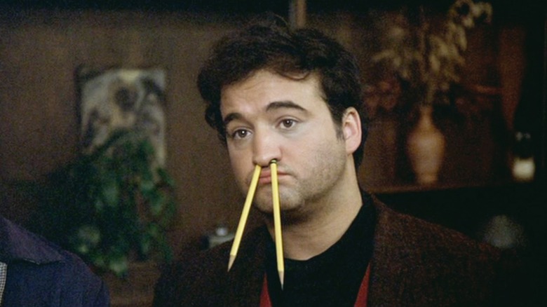 John "Bluto" Blutarsky with pencils in his nose in "Animal House"