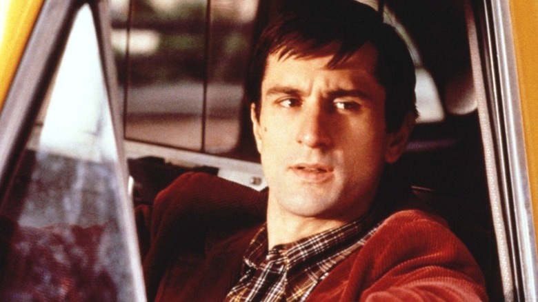 Travis Bickle sitting in his cab in "Taxi Driver"