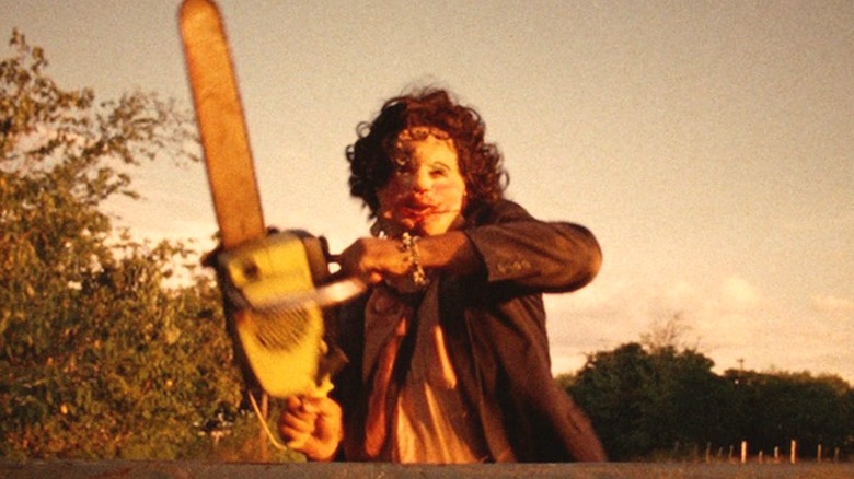 Leatherface wielding his chainsaw in "The Texas Chainsaw Massacre"