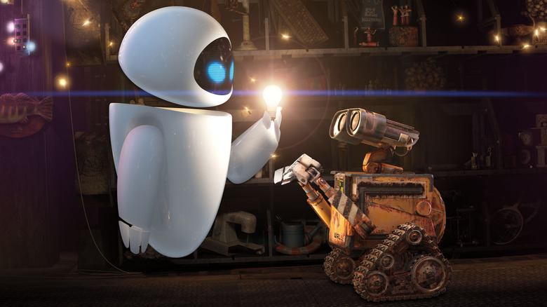 WALL-E and EVE looking at glowing light bulb