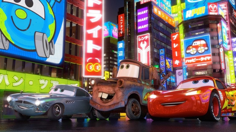 Finn McMissile, Mater, and Lightning McQueen driving through Tokyo in Cars 2
