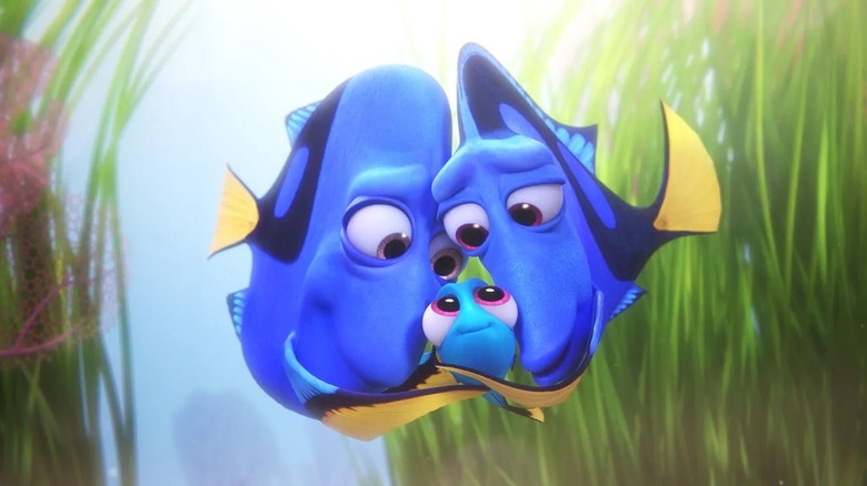 Young Dory hugged by her parents in Finding Dory