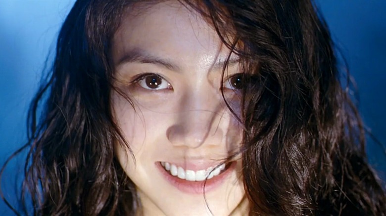 Tae-ju smiling maniacally in Thirst (2009)
