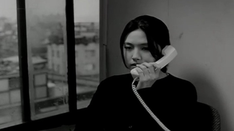 Soo-jung talking on the phone in Virgin Stripped Bare by Her Bachelors (2000)