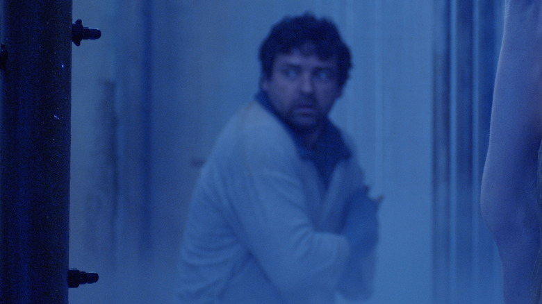 Jeff looks at Danica in a freezer
