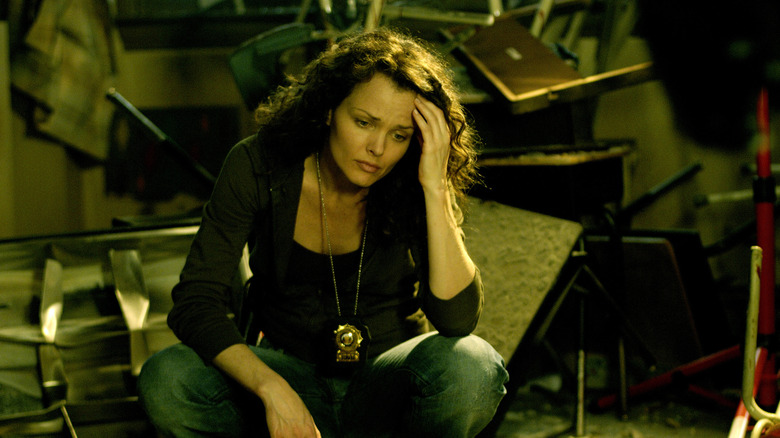 Allison investigates Troy's crime scene