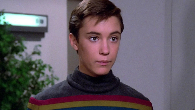 Wesley stands quietly in the corner in Star Trek: The Next Generation