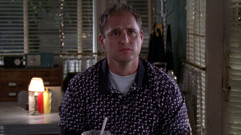 TJ looking forlorn at Luke's Diner on Gilmore Girls
