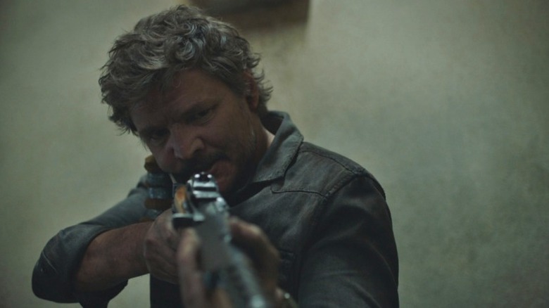 Joel aiming rifle
